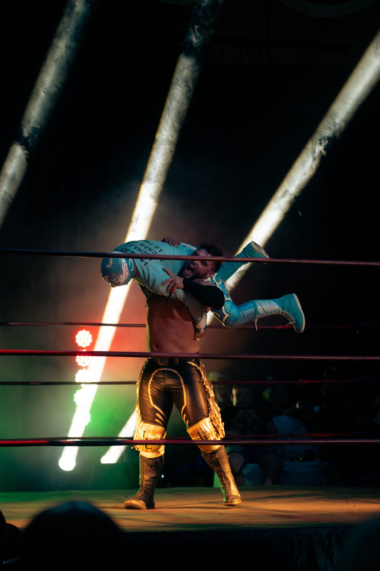 Lucha libre wrestler mid-move